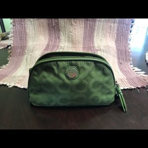 Green Coach makeup bag.